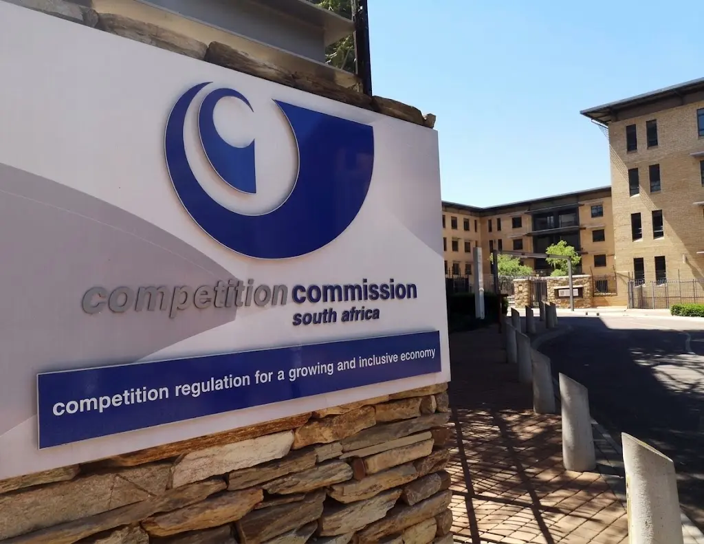 Competition Commission South Africa sign outside building entrance in Pretoria
