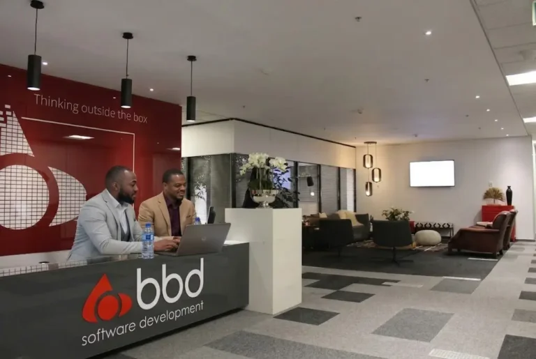 BBD software engineers collaborating in a modern IT office workspace